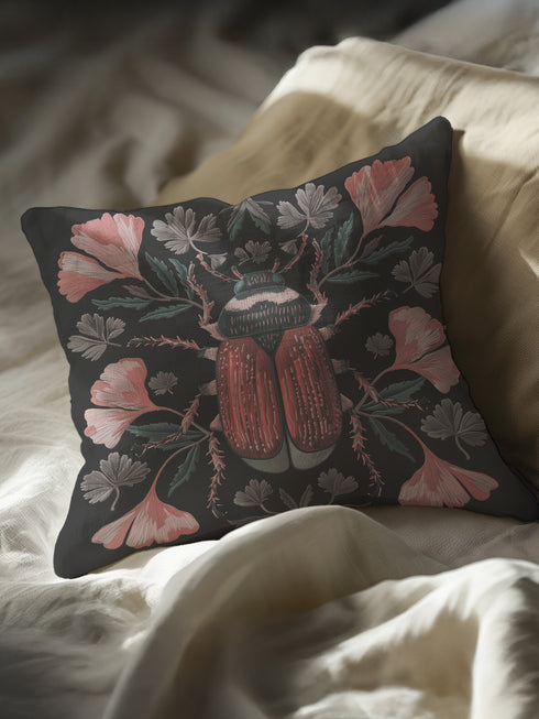 Elegant black pillowcase featuring detailed coral-red beetle illustration centered amid symmetrical pink flowers and gray-green foliage. The dark background enhances the intricate entomology artwork with fine detailing throughout the botanical and insect elements.